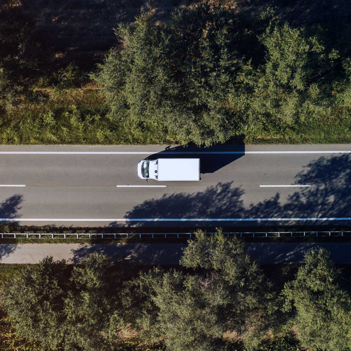 Aerial view of a sprinter van on a county road